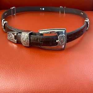 Beautiful supple brown leather belt with silver tone southwest style accents.